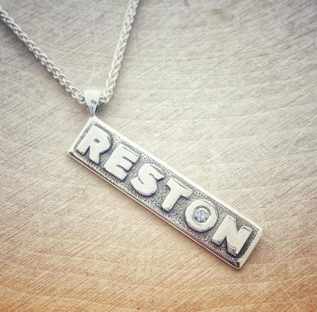Sterling silver Reston necklace with a lab grown diamond "O". $200.00 - - 50% of every purchase goes to the Reston Museum.