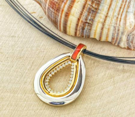 18 karat and sterling silver with inlaid carnelian and lab grown diamond pendant. $1175.00