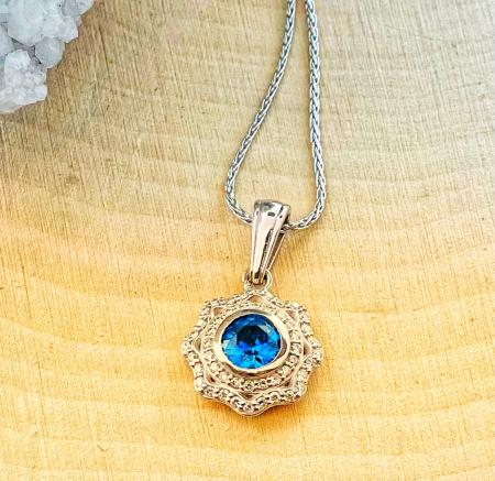 14 karat white gold sapphire and lab grown diamond pendant on chain. $1721.00