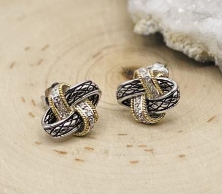 Sterling silver, 18 karat yellow gold diamond love knot stud earrings. $550.00