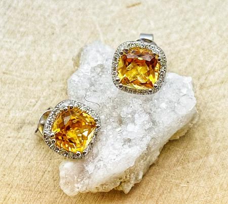 14 karat white gold 1.48ctw cushion citrines .06ctw diamond halo stud earrings. $680.00