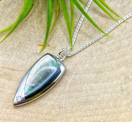 Sterling silver gray mother of pearl and zirconia pendant on 16" chain.  $123.00