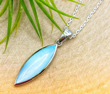 Sterling silver blue mother of pearl pendant on 18" chain.  $180.00