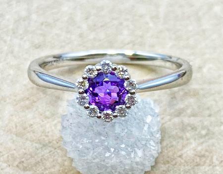 14 karat white gold .34ct round amethyst and .10ctw lab diamond accented ring. $775.00