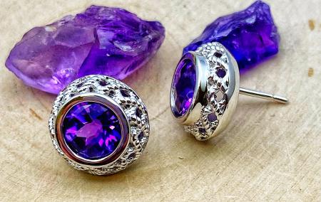 Sterling silver and checkerboard cut amethyst earrings. $175.00