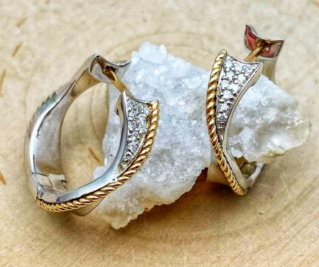 Sterling silver and 18 karat gold diamond hoop earrings. $500.00