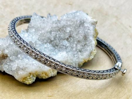 Sterling silver filigree bangle bracelet. $250.00