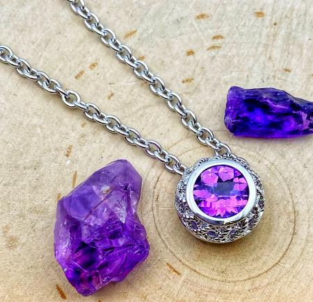 Sterling silver and checkerboard cut amethyst necklace. $225.00
