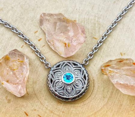 Sterling silver Swiss blue topaz, diamond and filigree necklace. $425.00