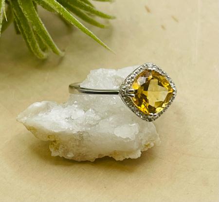 14 karat white gold cushion citrine and diamond ring. $810.00