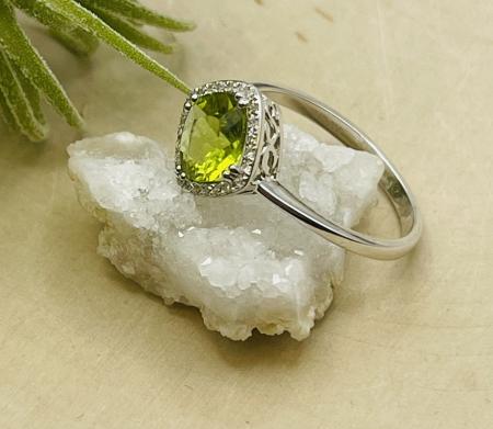 14 karat white gold cushion peridot and diamond ring. $810.00