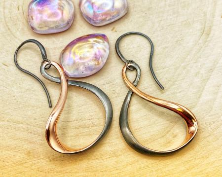 Sterling silver, 18 karat rose gold and ruthenium vermeil dangle earrings. $282.00