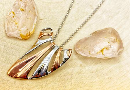 Sterling silver and 18 karat rose gold vermeil wing necklace. $277.00