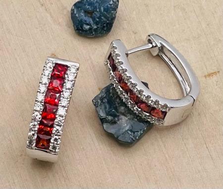 14 karat white gold .80ctw princess cut ruby and .31ctw diamond click-in earrings. $2390.00