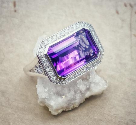 14 karat white gold 6.74 carat emerald cut amethyst and diamond halo ring. $2070.00