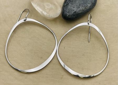 Sterling silver abstract circle drop earrings. $95.00