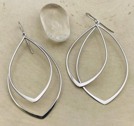 Sterling silver double pointed drop earrings. $150.00