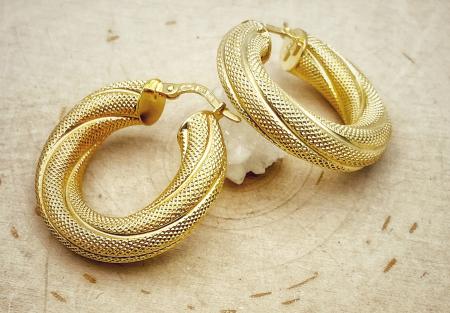 14 karat yellow gold textured hoops. $750.00