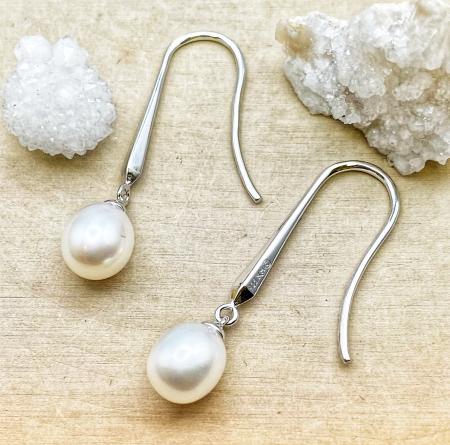 Sterling silver oval freshwater cultured pearl earrings. $150.00