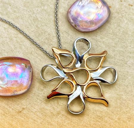 Sterling silver rose gold vermeil "Flames" pendant on 18" chain. $227.00
