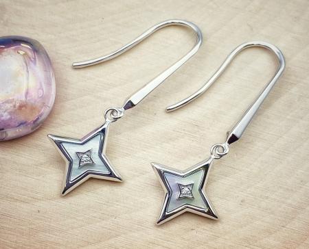 Sterling silver mother of pearl and cubic zirconia star earrings. $165.00
