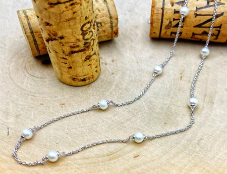 Sterling silver freshwater cultured pearl station necklace. $230.00