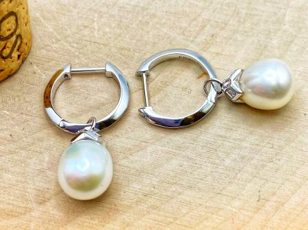 Sterling silver and freshwater cultured pearl earrings with cubic zirconia accents. $175.00