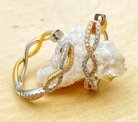 14 karat yellow and white gold diamond infinity hoop earrings. $2815.00