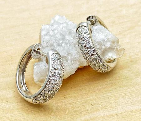 14 karat white gold diamond pave hoop earrings. $1250.00