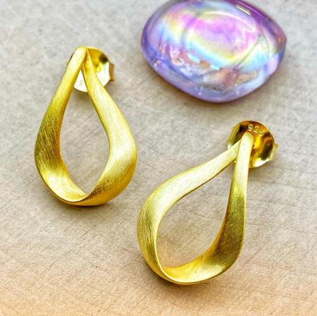 Sterling silver and 18 karat gold vermeil satin earrings. $95.00