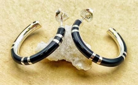 Sterling silver high polished black resin hoops. $210.00