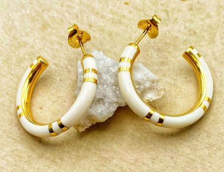 Sterling silver and 14 karat gold vermeil white resin hoops. $255.00