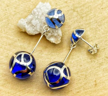 Sterling silver dark blue resin ball earrings. $285.00