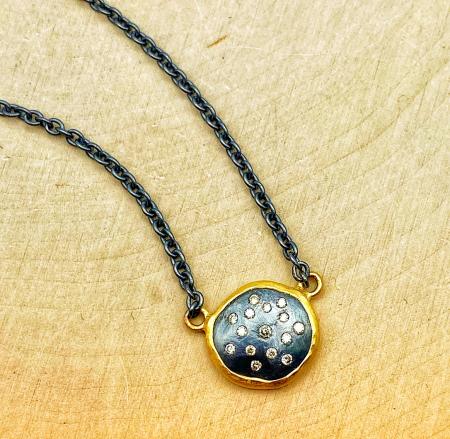 22 karat yellow gold and oxidized sterling silver 12mm diamond necklace. $970.00