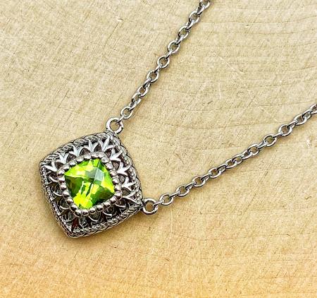 Sterling silver checkerboard cut peridot necklace. $250.00