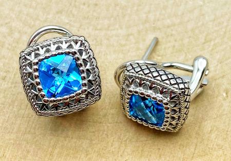 Sterling silver checkerboard cut Swiss blue topaz earrings. $250.00 
