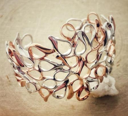 Sterling silver and 18 karat rose gold vermeil "Flames" bangle bracelet. $965.00