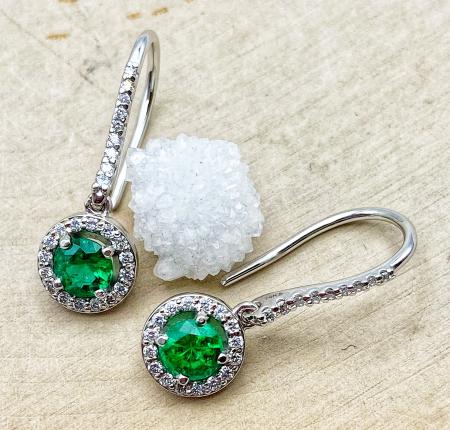14 karat white gold emerald and diamond dangle earrings. $3950.00