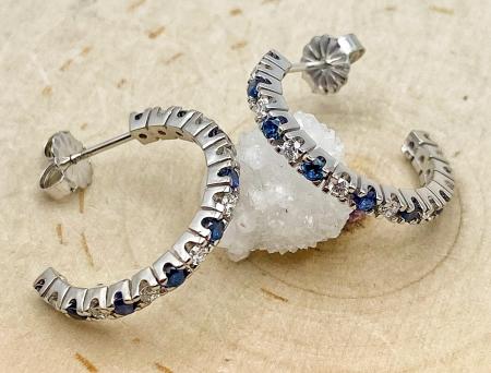 14 karat white gold blue sapphire and diamond hoops. $1350.00