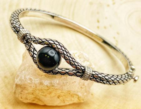 Sterling silver bangle bracelet with an 8mm black onyx bead and diamond accents. $550.00**SOLD** **SOLD** May be special ordered
