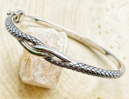 Sterling silver textured interlocking bangle bracelet. $200.00