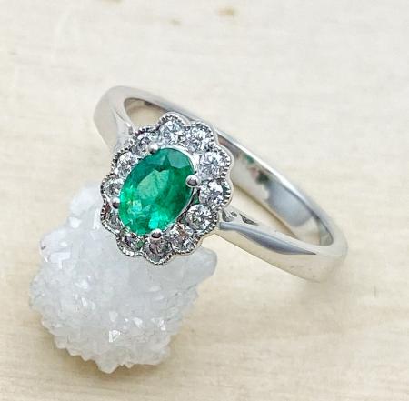 14 karat white gold emerald and diamond ring. $2250.00