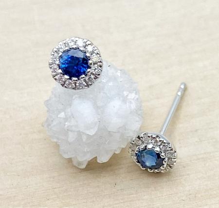 14 karat white gold blue sapphire an diamond halo earrings. $1350.00