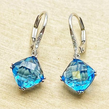 14 karat white gold checkerboard cut Swiss blue topaz and diamond earrings. $955.00