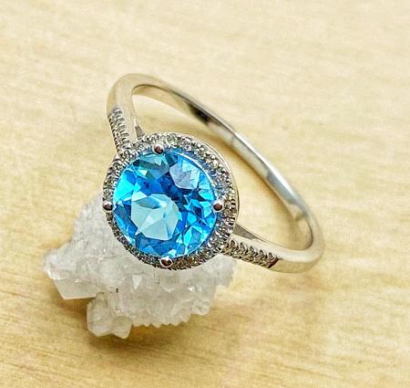 14 karat white gold Swiss blue topaz and diamond ring. $730.00