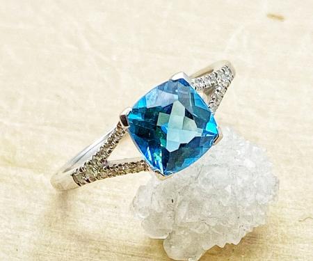 14 karat white gold cushion cut Swiss blue topaz and diamond ring. $790.00