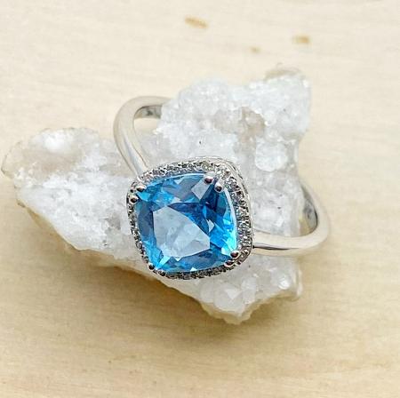 14 karat white gold cushion cut Swiss blue topaz and diamond ring. $750.00