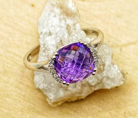14 karat white gold checkerboard cut amethyst and diamond ring. $730.00