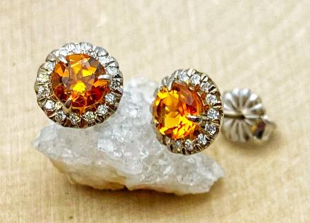 14 karat white gold citrine and diamond halo earrings. $750.00