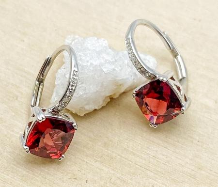 14 karat white gold cushion cut garnet and diamond earrings. $650.00